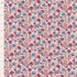 A close-up of a fabric pattern featuring a dense, small-scale floral print in pink, blue, red, and beige on a white background, with a ruler on the left side showing measurements in inches.