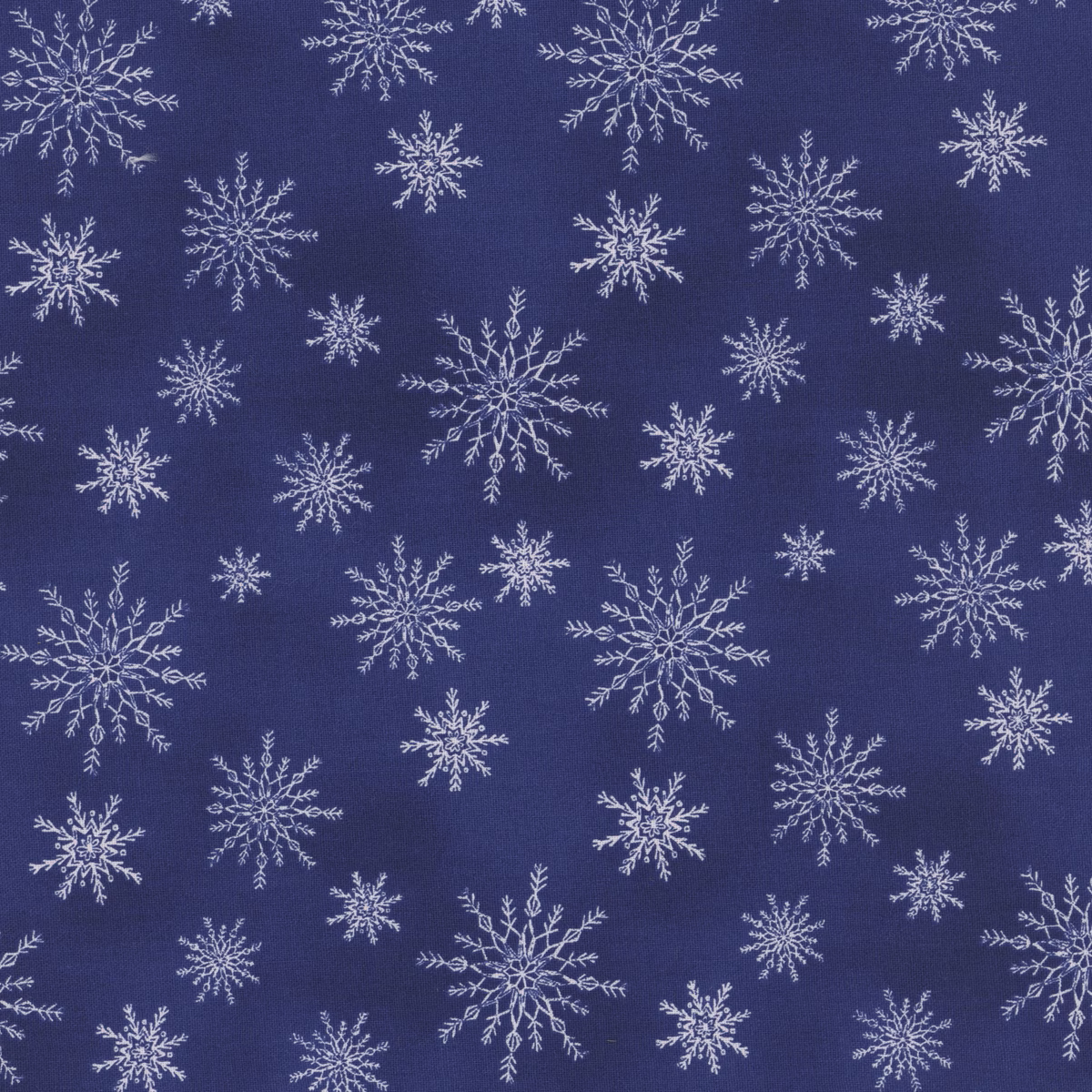 Pattern of white snowflakes on a blue background