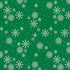 Pattern of white snowflakes on a green background