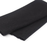 Folded black fabric on a white background