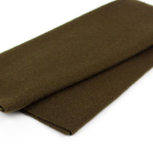 Brown fabric roll on a white background