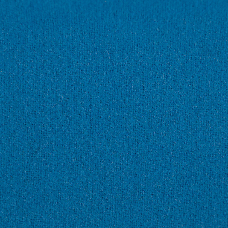 A close-up texture shot of a solid medium blue fabric.