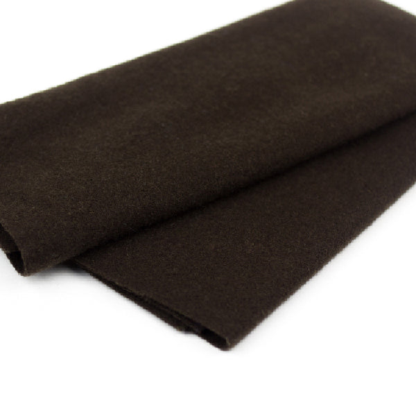 Brown fabric roll on a white background