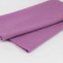 A folded piece of purple wool fabric shown on a plain white background.