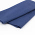 Folded blue fabric on a white background