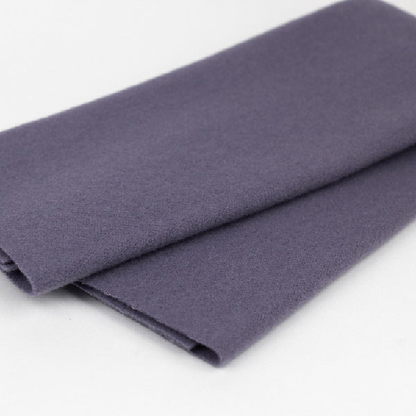 Folded dark gray fabric on a white background