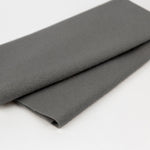 Folded gray fabric on a white background
