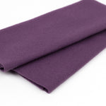 A folded piece of solid purple fabric, likely wool or felt, shown on a clean white background.
