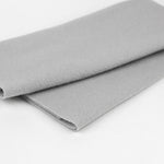 Folded gray fabric on a white background