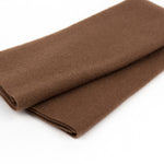 Folded brown fabric on a white background