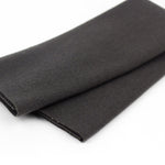 Folded black fabric on a white background