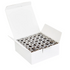 White box filled with black sewing bobbins on a white background