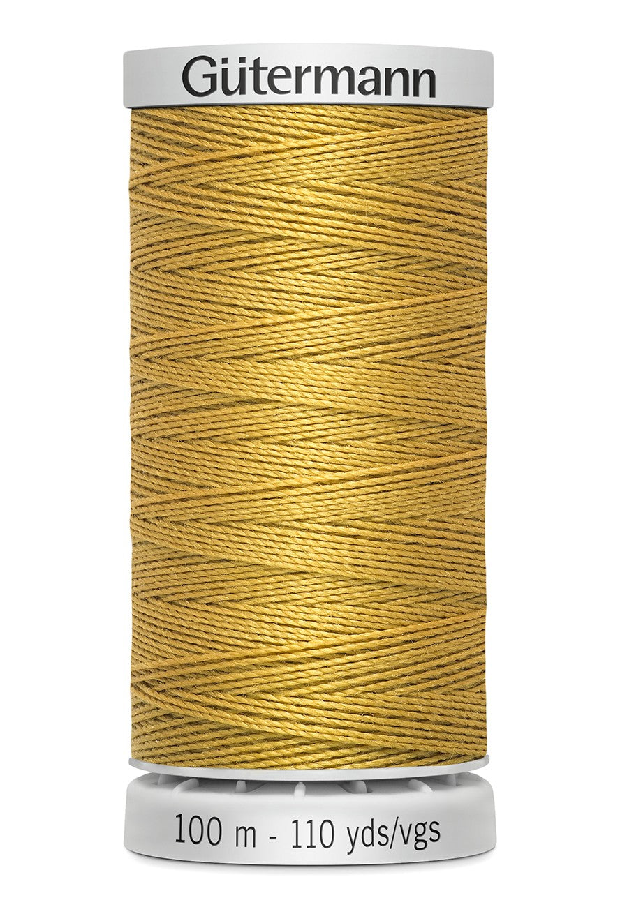 Spool of yellow thread with 'Gütermann' branding on a white background
