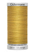 Spool of yellow thread with 'Gütermann' branding on a white background