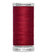 Spool of red Gutermann thread on a white background