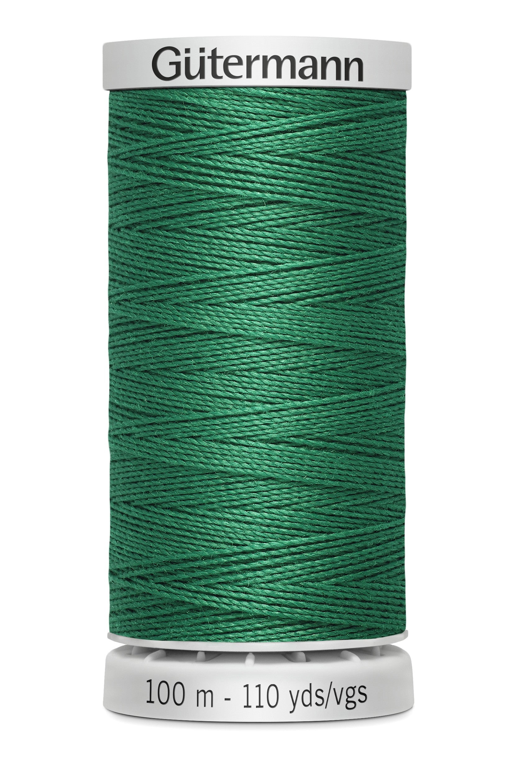 Green spool of Gutermann thread on a white background