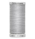 Spool of Gutermann thread on a white background