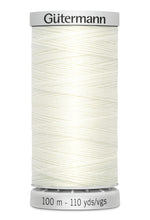 Spool of white thread with 'Gütermann' branding on a white background