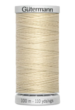 Spool of Gutermann thread on a white background