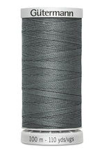 Spool of Gutermann thread on a white background