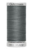 Spool of Gutermann thread on a white background