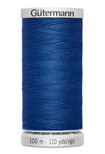Spool of blue thread with 'Gütermann' branding on a white background