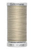Spool of Gutermann thread on a white background