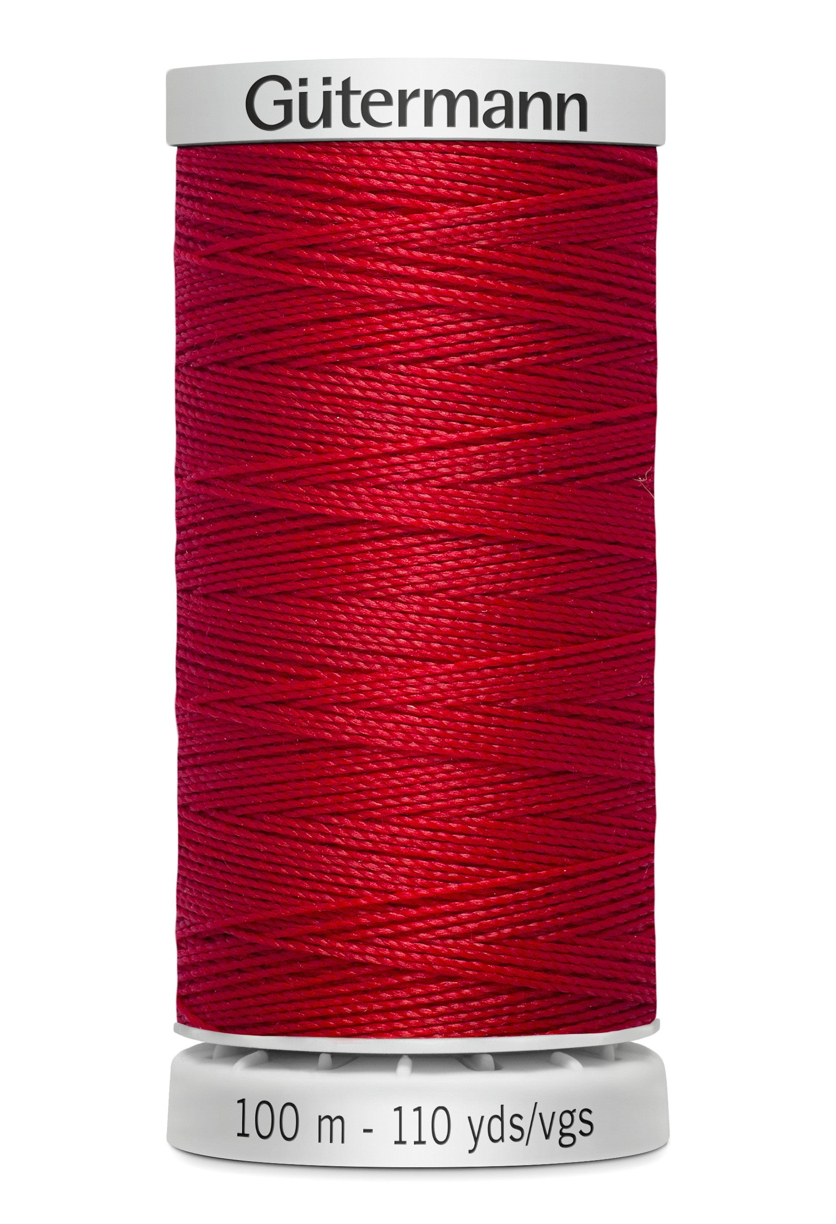 Red spool of Gütermann thread on a white background