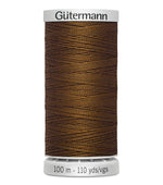 Spool of Gütermann thread on a white background