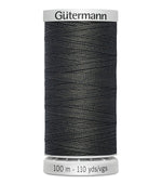 Spool of Gütermann thread on a white background