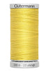 Spool of yellow thread with 'Gütermann' branding on a white background