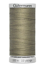 Spool of Gutermann thread on a white background