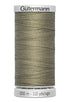 Spool of Gutermann thread on a white background