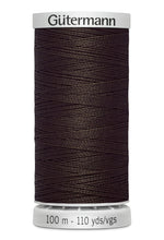 Spool of Gutermann thread on a white background