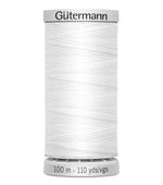 Spool of Gutermann thread on a white background