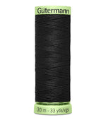 Spool of black thread with 'Gütermann' branding on a white background