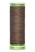 Spool of Gutermann thread with a green label on a white background