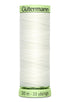 Spool of white thread with green label on a white background