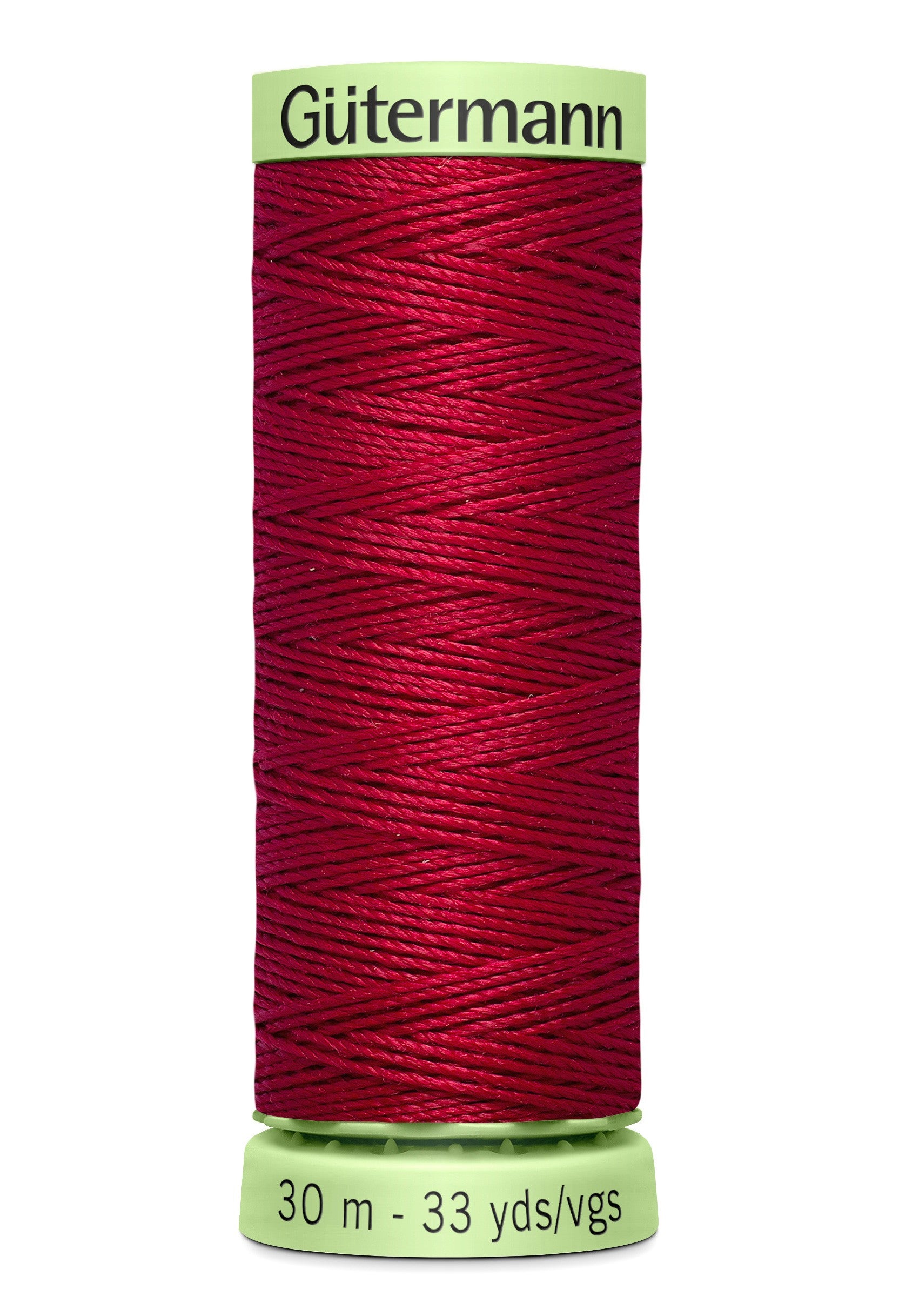 Spool of red thread with 'Gütermann' label on a white background