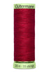 Spool of red thread with 'Gütermann' label on a white background