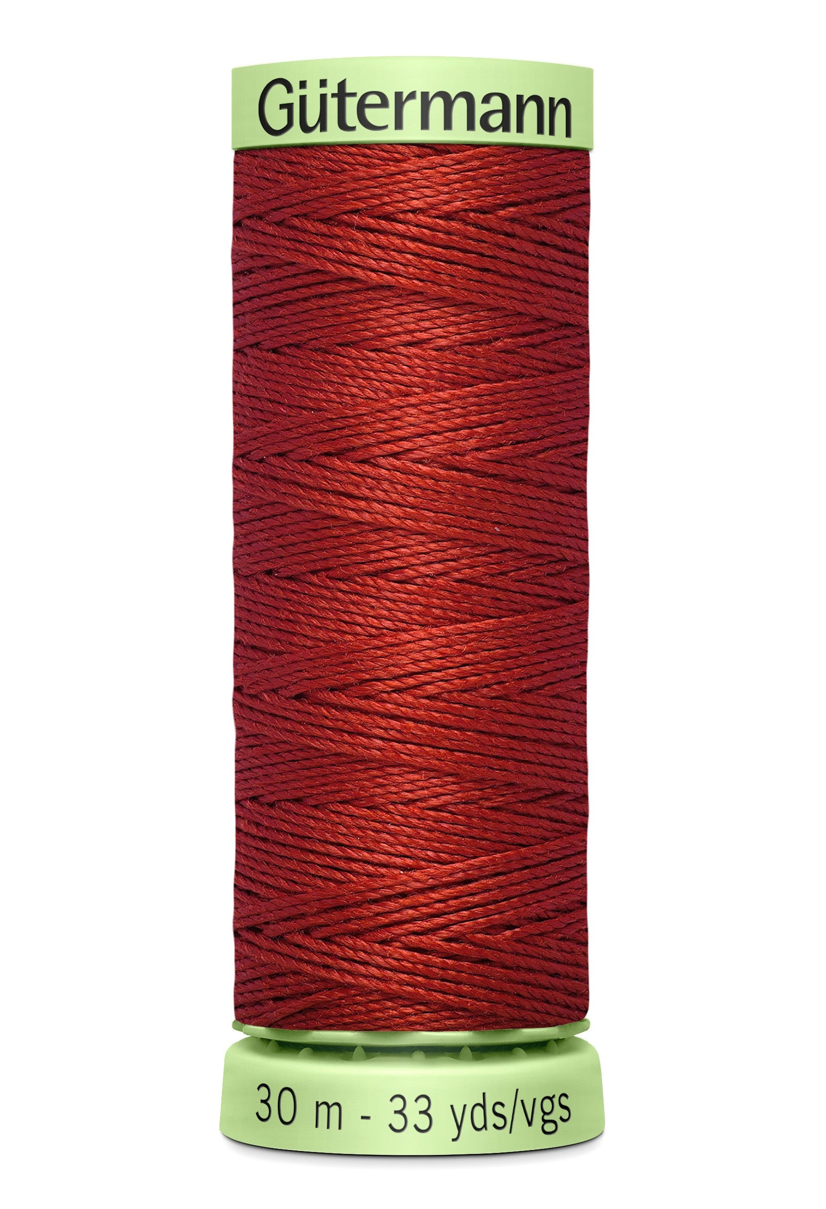 Spool of red thread with 'Gütermann' branding on a white background