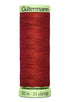 Spool of red thread with 'Gütermann' branding on a white background