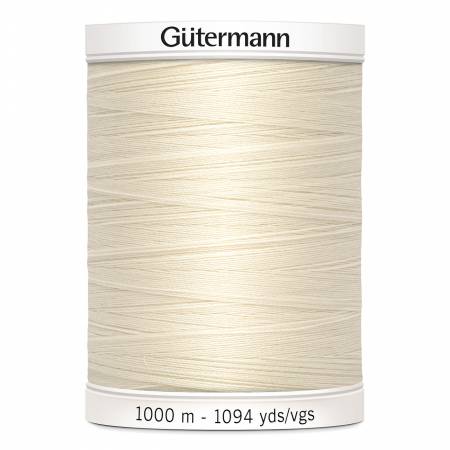 Spool of Gutermann thread on a white background