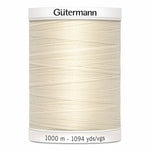 Spool of Gutermann thread on a white background