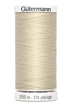 Spool of Gutermann thread on a white background
