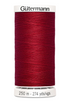 Spool of Gutermann thread on a white background