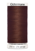 Spool of Gutermann thread on a white background