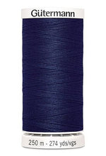 Spool of Gutermann thread on a white background