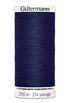 Spool of Gutermann thread on a white background