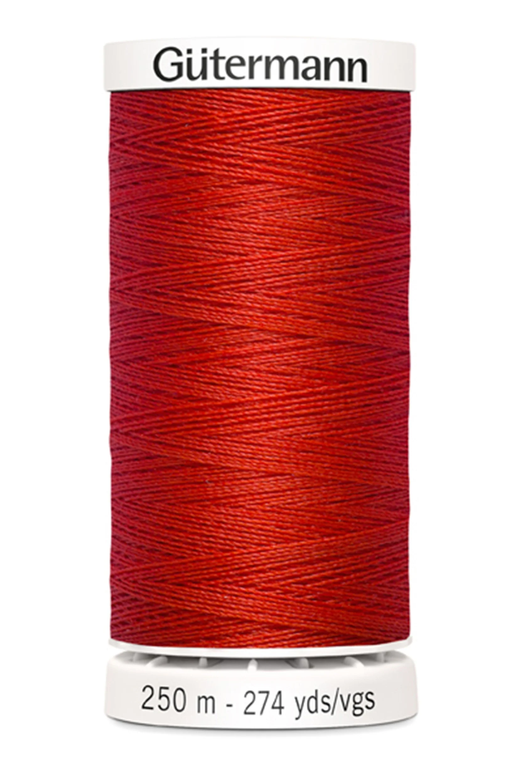 Red spool of Gutermann thread on a white background